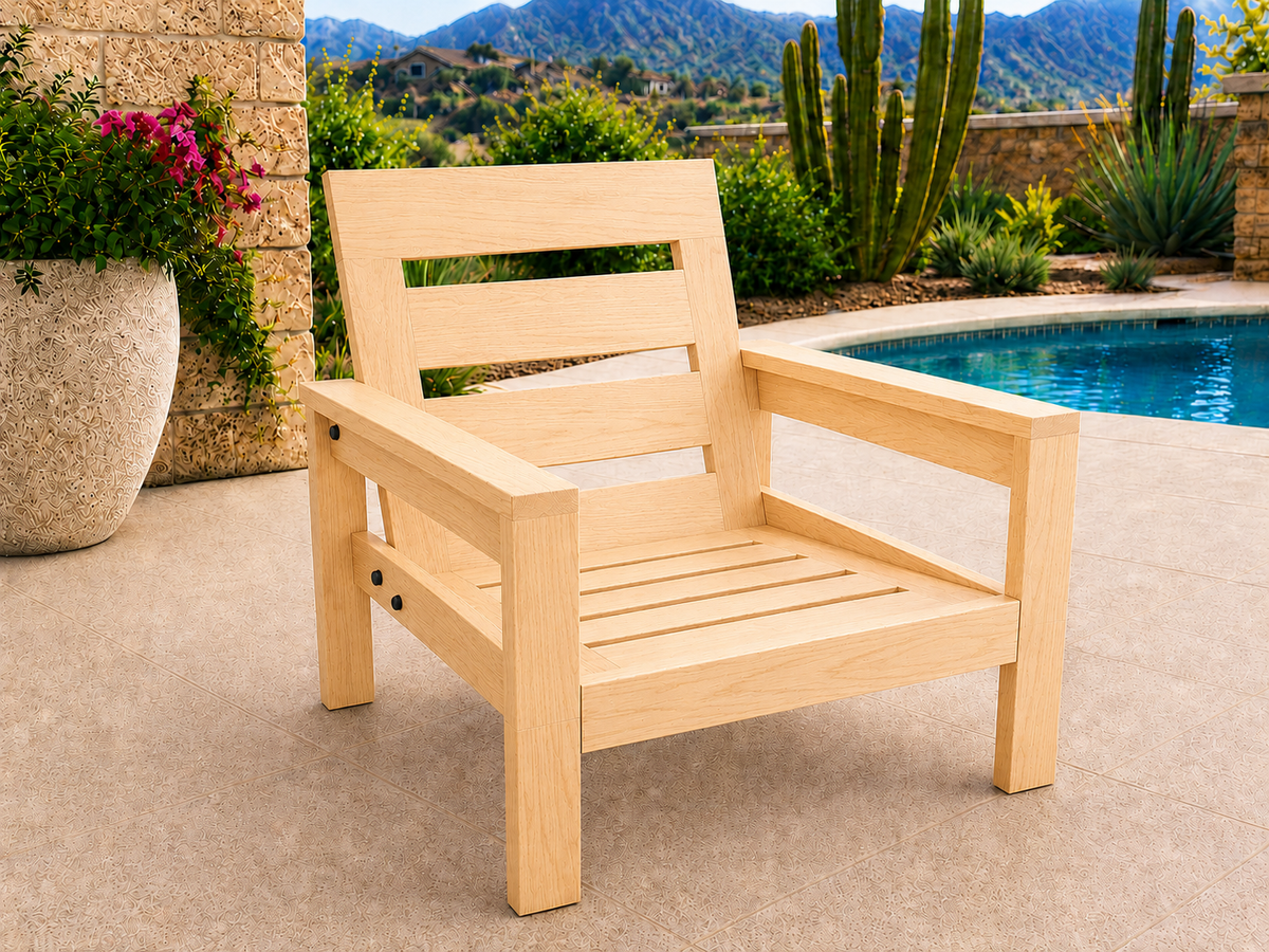 Classic Chair in Hard White Maple with Natural Satin finish and black hardware, shown without cushions on a desert patio.