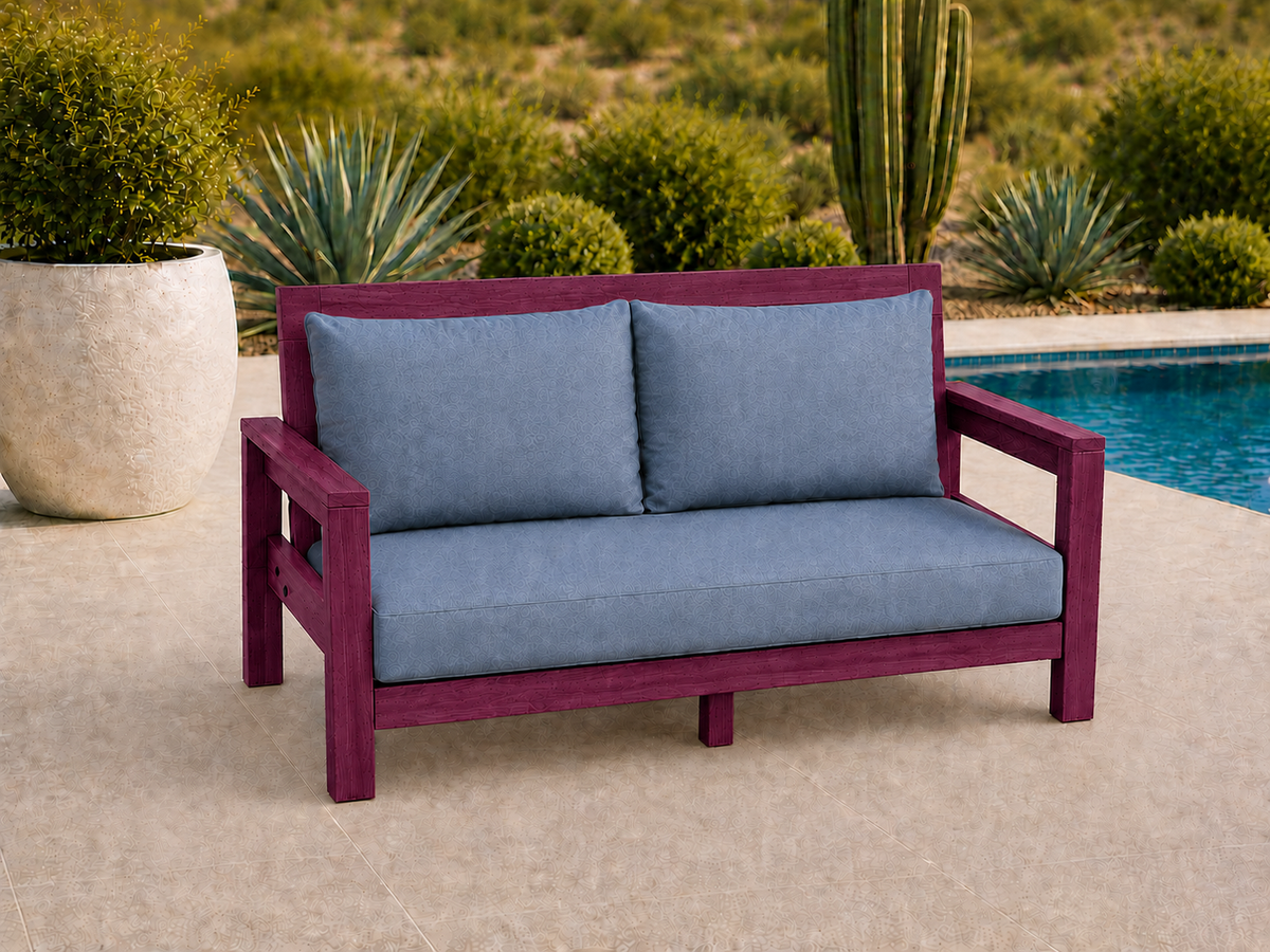 Classic Loveseat in Purpleheart with UV Satin Clear finish and blue cushions on a desert patio.