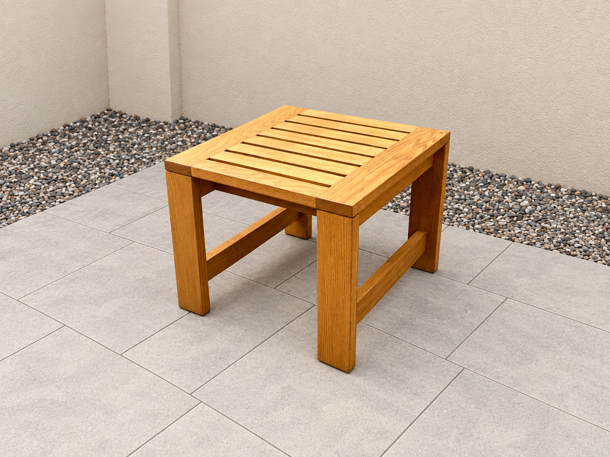 Classic End Table in Red Oak with Canyon Honey finish, with an edited clean patio background.
