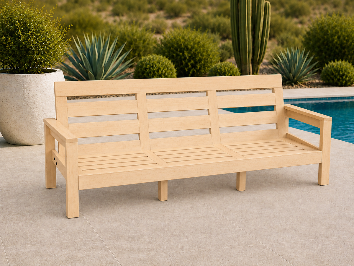 Classic Sofa in Red Oak with Canyon Honey finish and black hardware, shown without cushions on a desert patio.