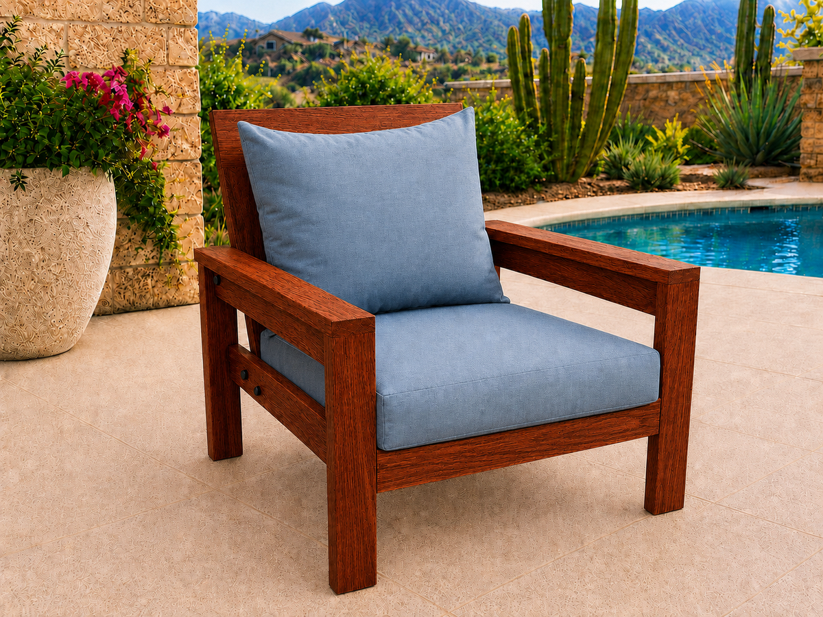 Classic Chair in African Mahogany with Satin Oil finish and blue cushions on a desert patio.
