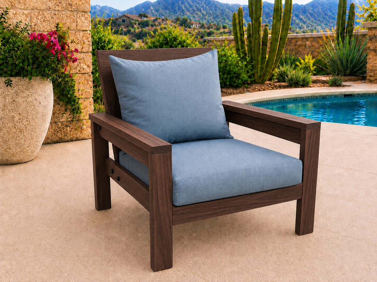 Classic Chair in Black Walnut with Matte Oil finish and blue cushions on a desert patio.