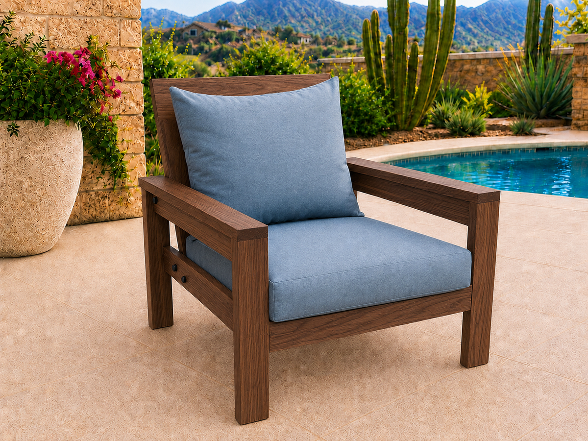 Classic Chair in Black Walnut with Natural Satin finish and blue cushions on a desert patio.