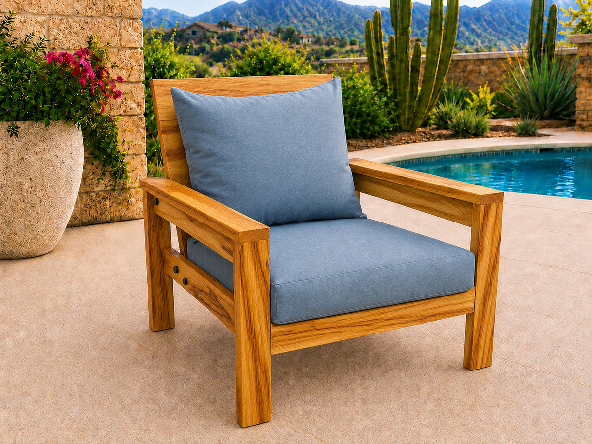Classic Chair in Canarywood with Natural Satin finish and blue cushions on a desert patio.