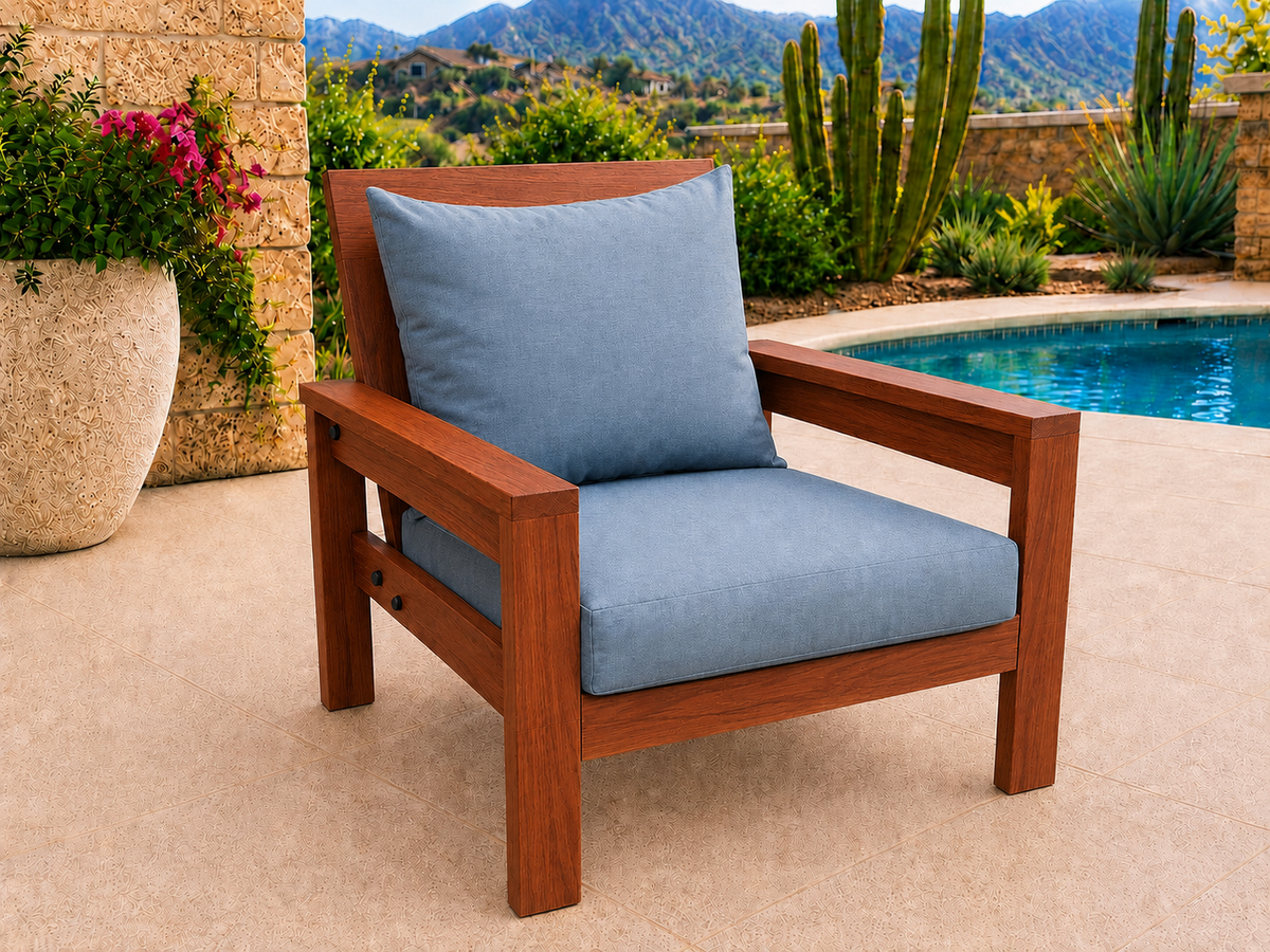 Classic Chair in Cherry with Satin Oil finish and blue cushions on a desert patio.