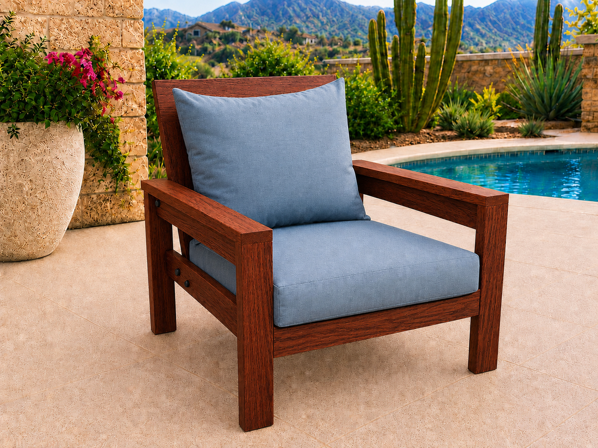 Classic Chair in Genuine Mahogany with Satin Oil finish and blue cushions on a desert patio.