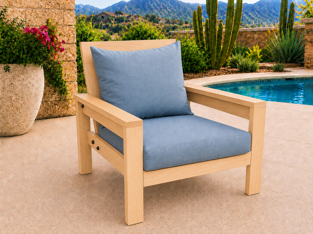 Classic Chair in Hard White Maple with Ultra Light Honey finish and blue cushions on a desert patio.