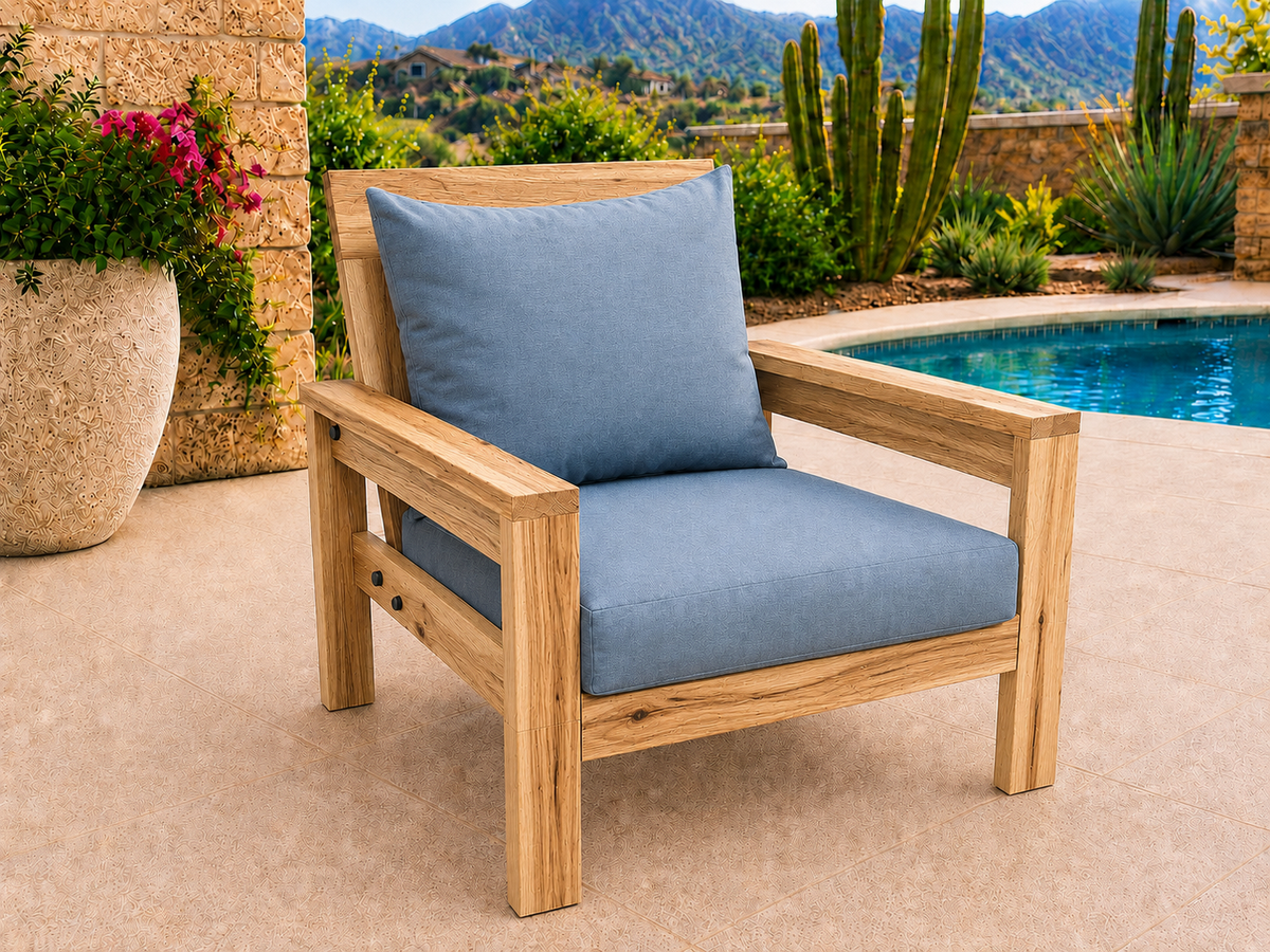 Classic Chair in Natural Hickory with Natural Satin finish and blue cushions on a desert patio.