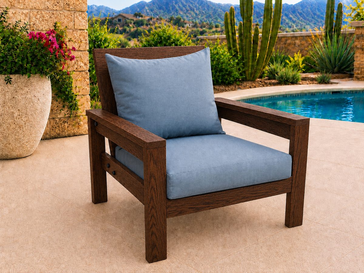 Classic Chair in Red Oak with Walnut Reserve finish and blue cushions on a desert patio.