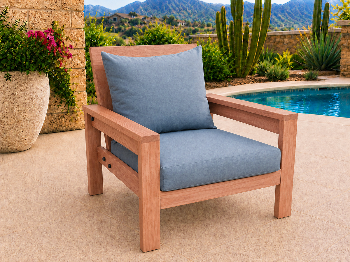 Classic Chair in Spanish Cedar with Natural Satin finish and blue cushions on a desert patio.