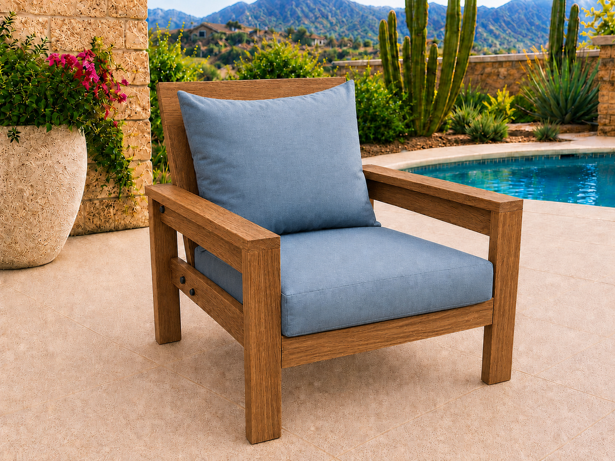 Classic Chair in Teak with Natural Teak Oil finish and blue cushions on a desert patio.