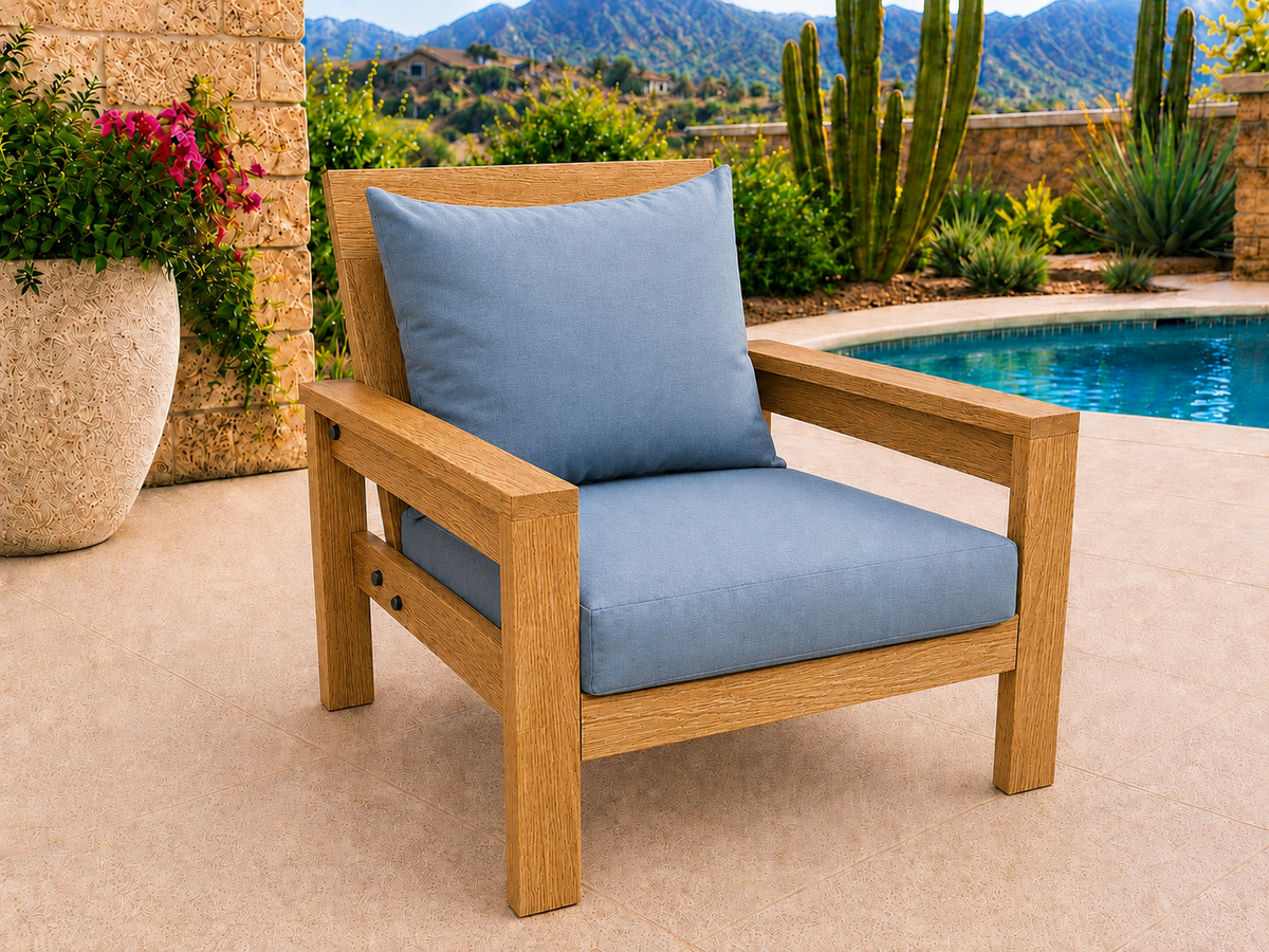 Classic Chair in White Oak with Canyon Honey finish and blue cushions on a desert patio.