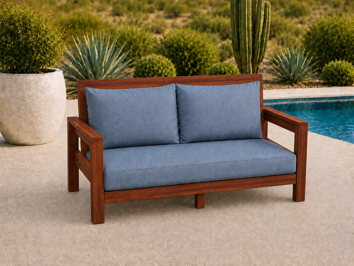 Classic Loveseat in Genuine Mahogany with Satin Oil finish and blue cushions on a desert patio.