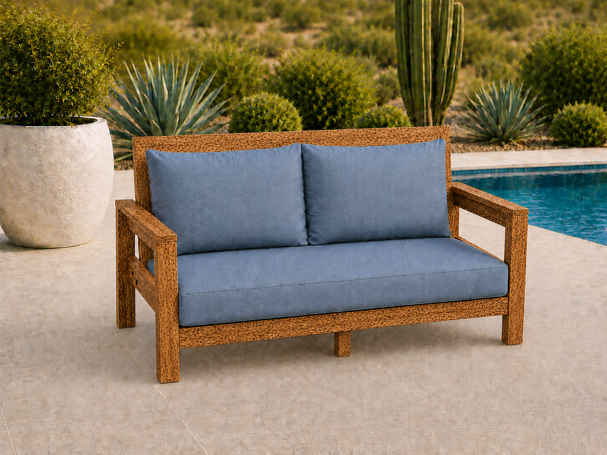 Classic Loveseat in Leopardwood with Satin Clear finish and blue cushions on a desert patio.