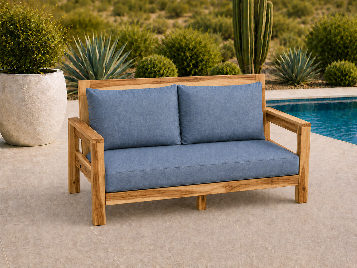 Classic Loveseat in Natural Hickory with Light Honey finish and blue cushions on a desert patio.