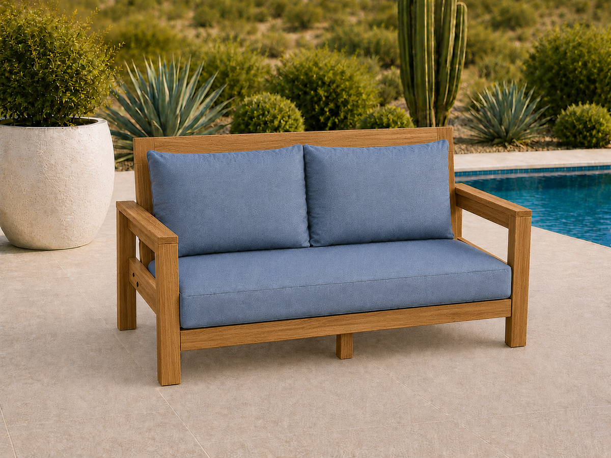 Classic Loveseat in Teak with Natural Teak Oil finish and blue cushions on a desert patio.