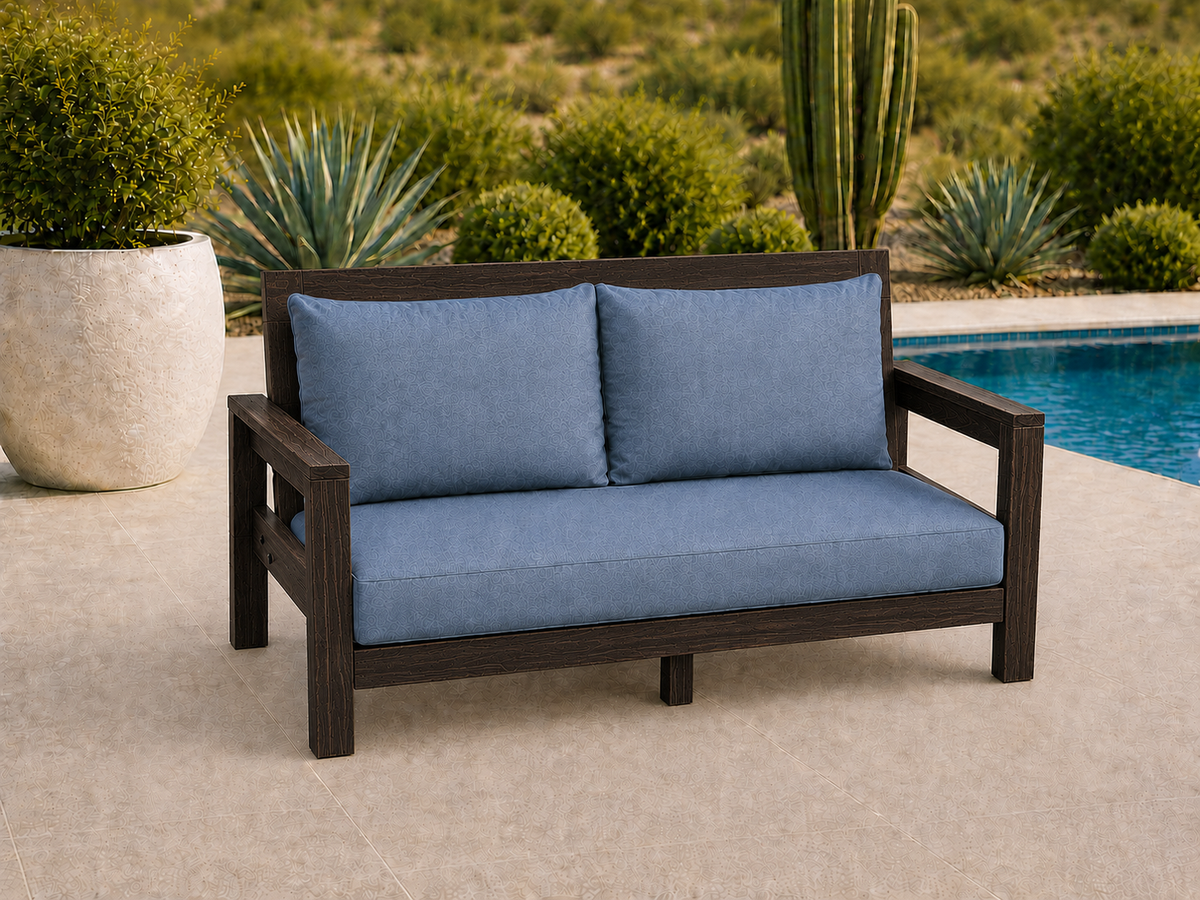 Classic Loveseat in Wenge with Satin Clear finish and blue cushions on a desert patio.