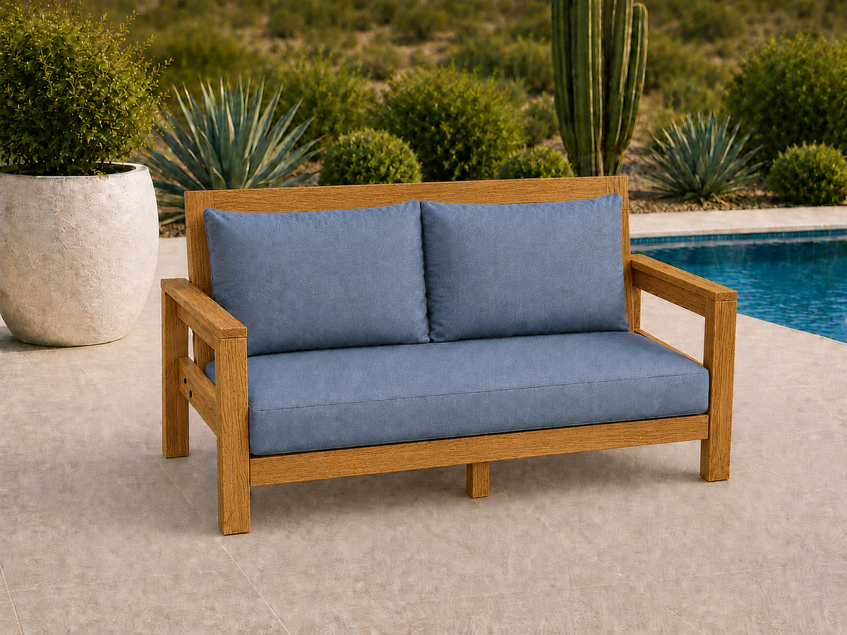 Classic Loveseat in White Oak with Canyon Honey finish and blue cushions on a desert patio.