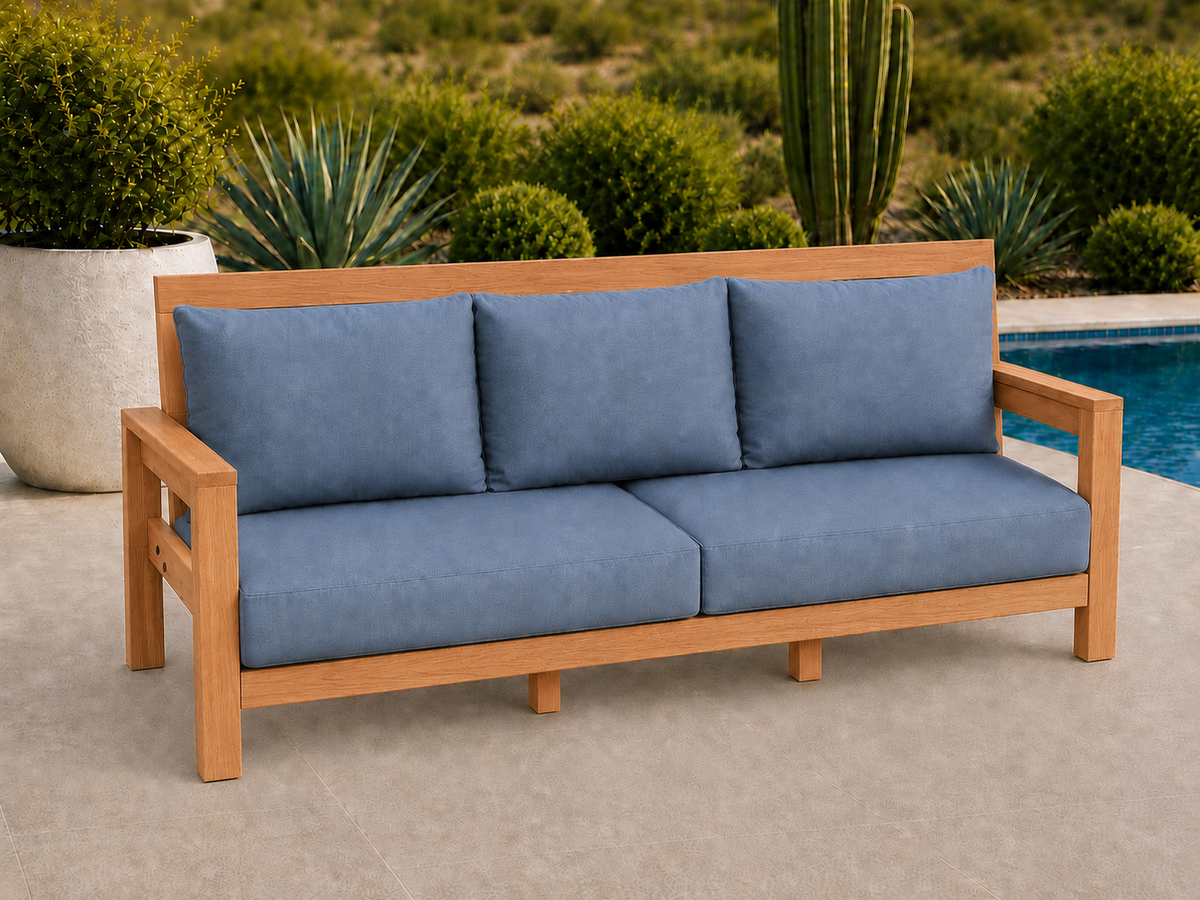 Classic Sofa in Cherry with Natural Satin finish and blue cushions on a desert patio.
