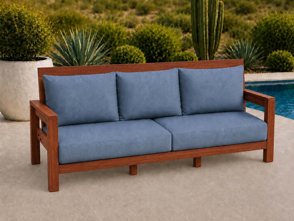 Classic Sofa in Genuine Mahogany with Satin Oil finish and blue cushions on a desert patio.