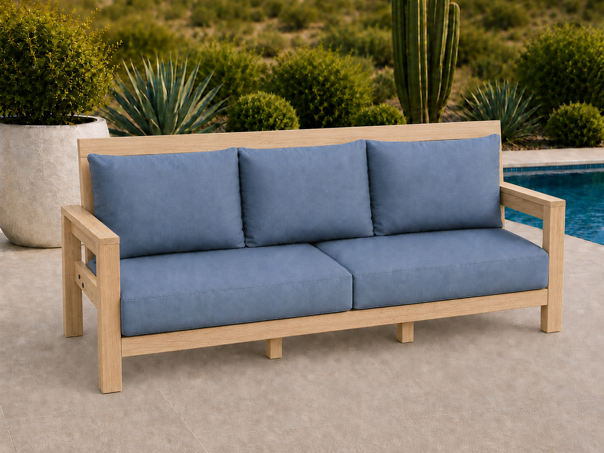 Classic Sofa in Natural Hickory with Natural Satin finish and blue cushions on a desert patio.