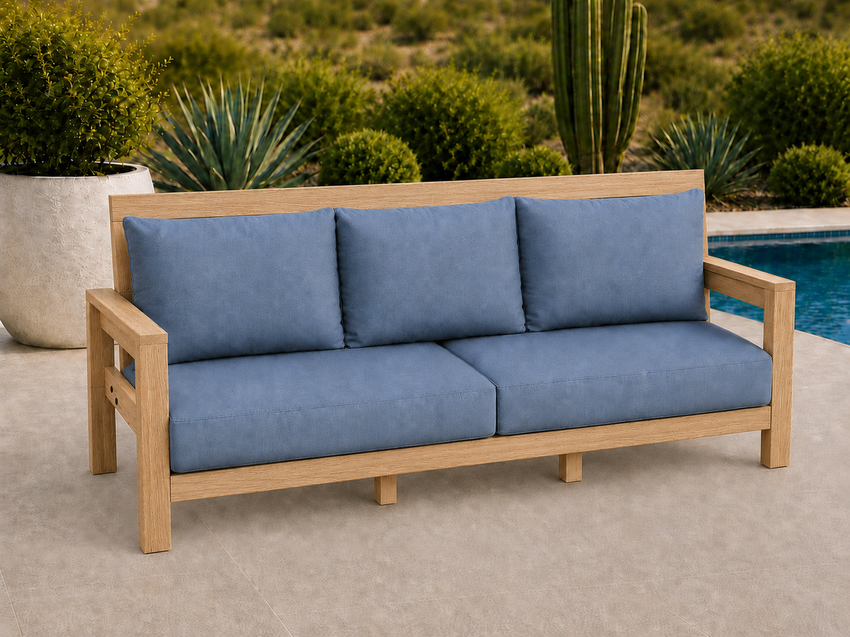 Classic Sofa in Red Oak with Natural Satin finish and blue cushions on a desert patio.